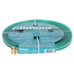 Flat coiled green Gilmour hose laid on its side with branded teal packaging strip and brass connector visible