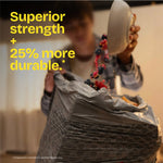 Lifestyle-style image of a person pouring food into a Glad trash bag with overlay text claiming superior strength and 25% more durable