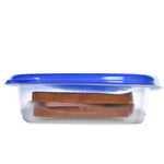 Side view of a clear Glad square container with blue lid showing a sandwich inside