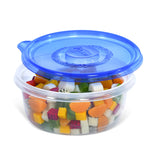 Clear round Glad container filled with diced fruit and topped with a translucent blue Glad lid slightly ajar.