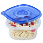 Clear Glad square container filled with pasta and a partially open blue Glad lid showing embossed center