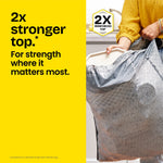 Hand holding a patterned Glad ForceFlex trash bag with text highlighting 2x reinforced top