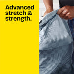 Close-up of hands holding a full gray patterned Glad ForceFlex trash bag against a yellow panel reading ‘Advanced stretch & strength.’