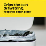 Close crop of a Glad patterned trash bag secured over a can rim with copy 'Grips-the-can drawstring. Keeps the bag in place.'