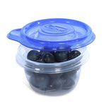 Clear Glad mini round container filled with blueberries and topped by a translucent blue Glad lid