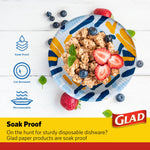 Glad paper bowl with scribble abstract pattern filled with granola and berries, infographic icons at left