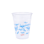 Single Glad clear plastic cup with repeating blue shark pattern and small Glad logo on white background