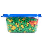 Side view of a clear Glad rectangular container packed with green peas, yellow corn and carrot slices sealed by a blue lid.