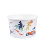 Single Glad paper snack bowl showing playful dog illustrations, bicycle, car and small Glad logo