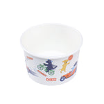 Overhead-angled view into a Glad paper snack bowl decorated with zoomie dogs, bicycle and car graphics