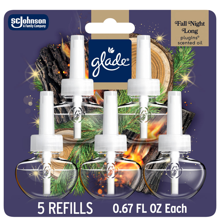 Glade PlugIns refill blister pack showing five clear oil refill bottles with white caps and a holiday-themed background.