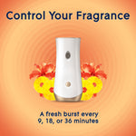 Glade automatic spray dispenser front with floral and pineapple artwork and text 'Control Your Fragrance'