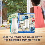 Lifestyle image showing Glade Beach Life packaging and a detached warmer on a kitchen table with blurred window and person in background