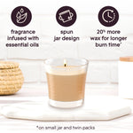 Single lit Glade jar candle on a surface with icons and copy highlighting fragrance infused with essential oils, spun jar design, and more wax