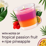 Glade pink-and-orange candle with passionfruit and hibiscus artwork and text noting tropical passion fruit and ripe pineapple notes