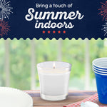 Promotional image of a lit Glade jar candle on a table with picnic-style props and 'Bring a touch of Summer indoors' headline