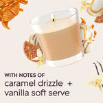 Floating lit Glade jar candle with caramel drizzle and vanilla soft serve imagery and text noting notes of caramel drizzle and vanilla
