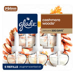 Front packaging of Glade Cashmere Woods plug-in scented oil refills showing five clear refill bottles and Glade logo.