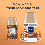 Two Glade Cashmere Woods refill cans with updated packaging displayed against a warm peach background and promotional headline