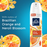 Glade Citrus Sunrise aerosol can on blue background with text noting Brazilian orange and neroli blossom notes