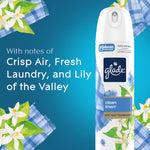 Close-up of Glade Clean Linen aerosol can with floral and gingham accents and copy describing scent notes