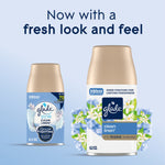 Glade Clean Linen automatic spray refill packaging showing older and new can designs with floral artwork.