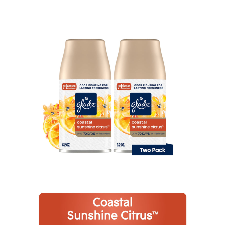 Two Glade Coastal Sunshine Citrus automatic spray refill cans with floral and citrus graphics on white background