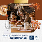 Lifestyle holiday scene of family baking with Glade PlugIns warmer graphic and gingerbread accents promoting refill stocking