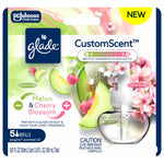 Close-up of Glade CustomScent retail blister pack art showing refill bottle, melon and cherry blossom imagery and 'CustomScent' branding.
