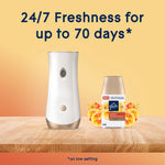Glade automatic dispenser and Coastal Sunshine Citrus refill on a wood surface with '24/7 Freshness up to 70 days' text