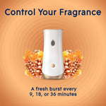 White Glade automatic dispenser with Cashmere Woods floral artwork and text about controlling fragrance intervals
