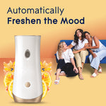 Glade automatic dispenser with three people on a couch in the background and citrus accents, 'Automatically Freshen the Mood' text