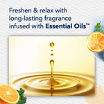 Graphic showing a golden oil droplet splash and text about long-lasting fragrance infused with essential oils