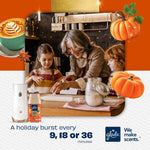 Lifestyle scene of family baking with Glade automatic spray device and Golden Pumpkin & Spice refill pictured with pumpkins and latte art