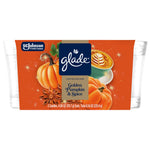 Front-on product image of Glade limited edition golden pumpkin & spice two candles in clear glass jars with orange label art