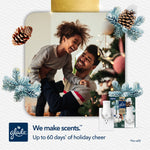 Warm lifestyle photo of a smiling father lifting a child near a decorated holiday tree with small Glade product images and logo