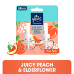 Front packaging artwork of Glade Juicy Peach & Elderflower plug-ins showing two refill bottles and peach floral graphics
