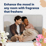 Lifestyle image of a smiling couple on a couch with headline about enhancing the mood with fragrance