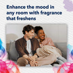 Smiling couple seated on a couch lifestyle image used in Glade packaging to suggest enhanced room fragrance