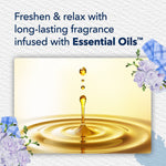 Graphic of golden oil droplet hitting a liquid surface with text about long-lasting fragrance infused with essential oils