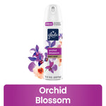 Glade Orchid Blossom soft mist aerosol can with floral artwork and product name on white background.