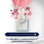 Plug-in air freshener in outlet with cherry blossom imagery and text indicating turn dial right for cherry blossom