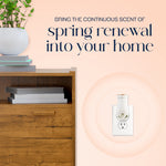 Decorated room vignette showing a Glade plug-in diffuser in an outlet with headline about bringing spring renewal into your home