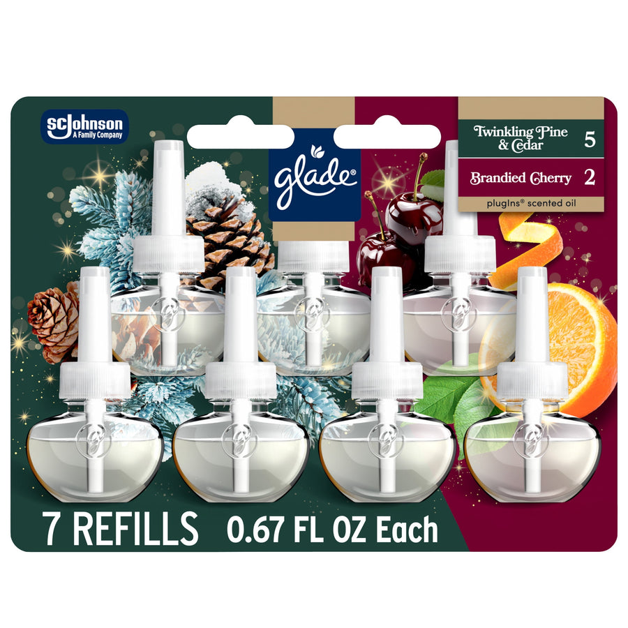 Retail blister pack of seven Glade PlugIns refill bottles with winter pine and cherry imagery
