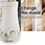 Close-up of a Glade PlugIns wall warmer with textured white body next to text reading “Change the mood in any room”