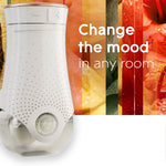 Close-up of a Glade PlugIns electric warmer front with textured white body against a colorful tropical orange and yellow background and mood-changing text