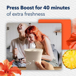 Person pressing the boost button on a Glade Scent Flow device with text noting a 40 minute boost for extra freshness.