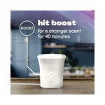 White Glade Scent Flow device on wood surface with callout explaining a 40-minute boost feature