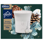 Glade Scent Flow starter device and refill shown against pinecone and frosted evergreen holiday illustration.