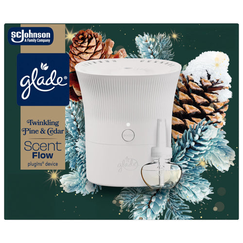 Glade Scent Flow starter device and refill shown against pinecone and frosted evergreen holiday illustration.